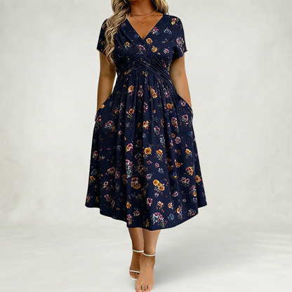 Santander | Vestido floral con escote en V y detalle de torsión en la cintura elegante.
