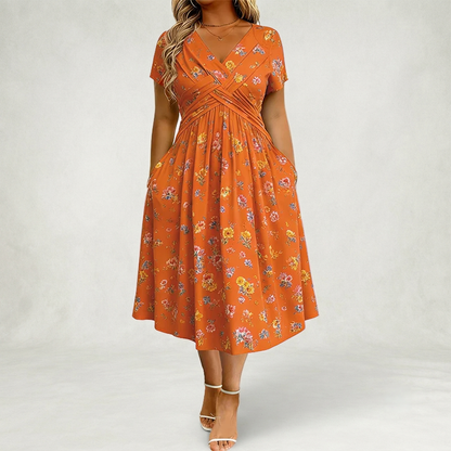 Santander | Vestido floral con escote en V y detalle de torsión en la cintura elegante.